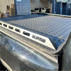 Silver metallic aluminum heavy-duty hard lid with diamond plate texture and black rubber edge for byd shark 2025+ truck bed