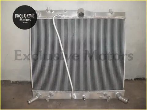 Silver aluminum radiator with ribbed core and mounting fittings for 2005-2009 toyota hiace 25l turbo diesel