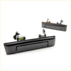 Black plastic door handle set for Toyota Hilux ute 1984-1988 with integrated spring and mounting hardware shown from back side