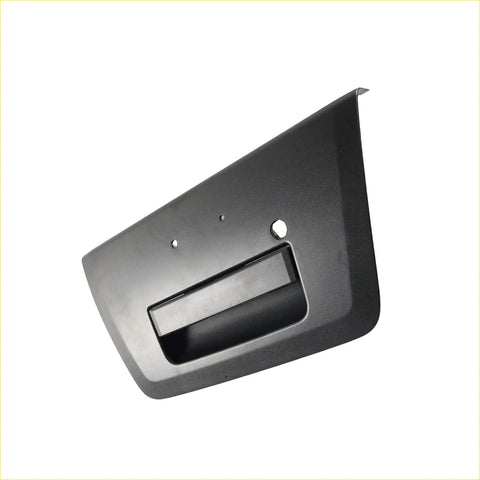 Black plastic tailgate handle cover with key hole for Nissan Navara shown from the back side