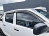 Black plastic window visors installed on a white toyota hilux 2012-2015 with bonnet guard matte black monsoon design