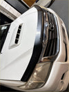 White toyota hilux with a matte black bonnet guard and black front bumper guard chrome grille monsoon 2012-2015