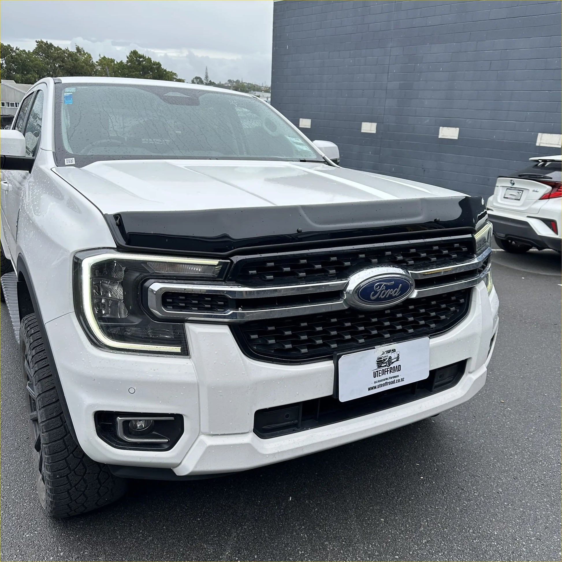 White ford ranger 2022 with black bonnet guard stone protector and chrome grille for new ranger models