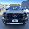 Black and gold ford ranger with bonnet guard protector and stone guard featuring bold grille and chrome accents