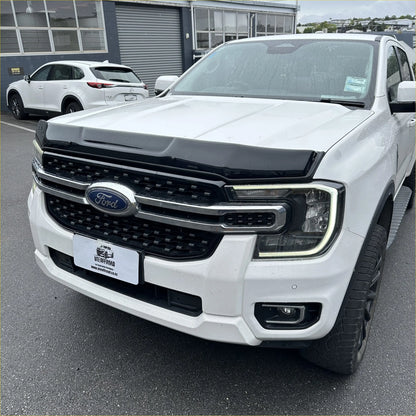 White ford ranger with black front grille and chrome accents featuring bonnet guard protector stone guard for 2022+ models