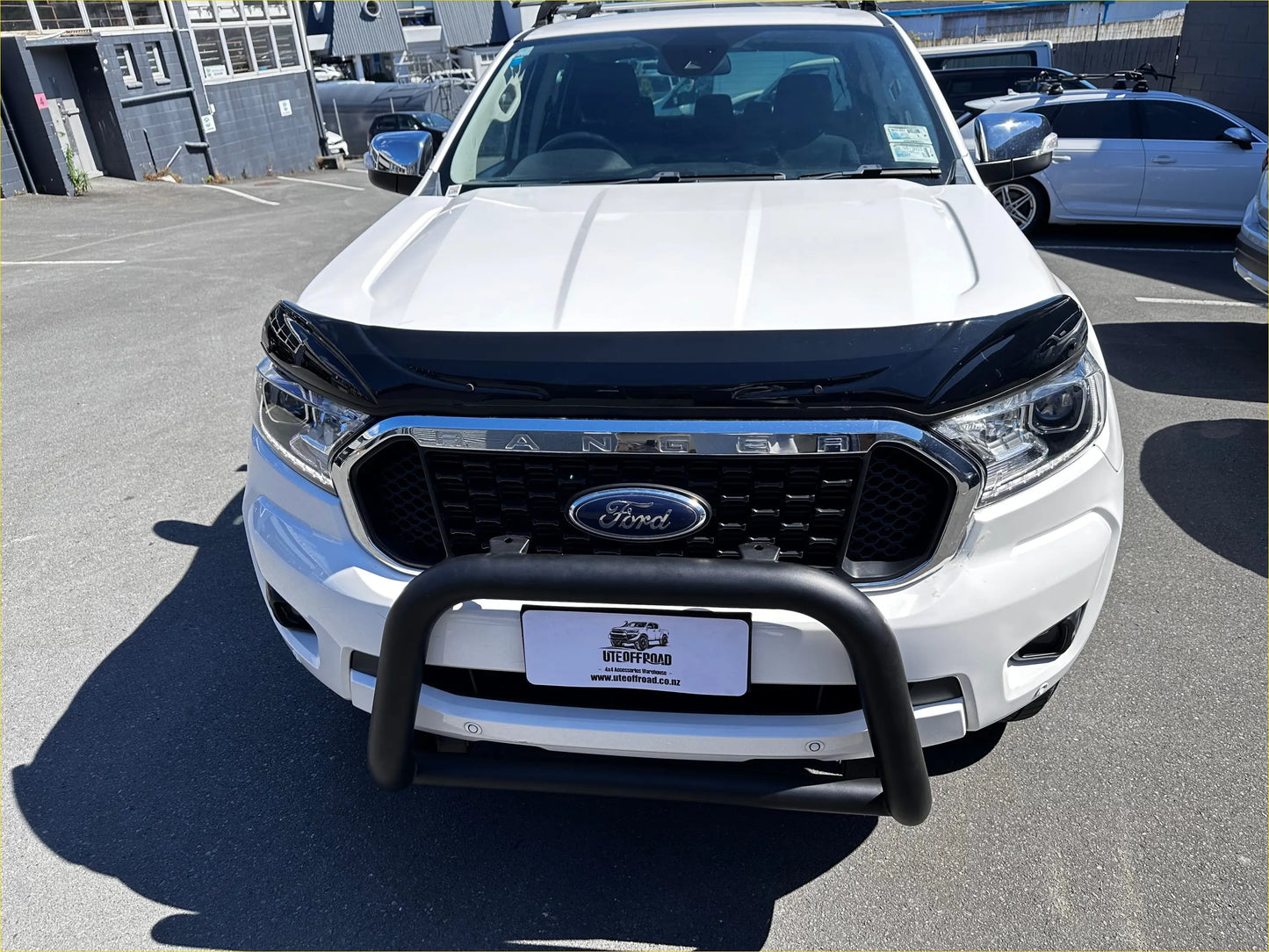 White ford ranger with black front bumper guard and chrome grille featuring bonnet guard protector stone guard px2 px3
