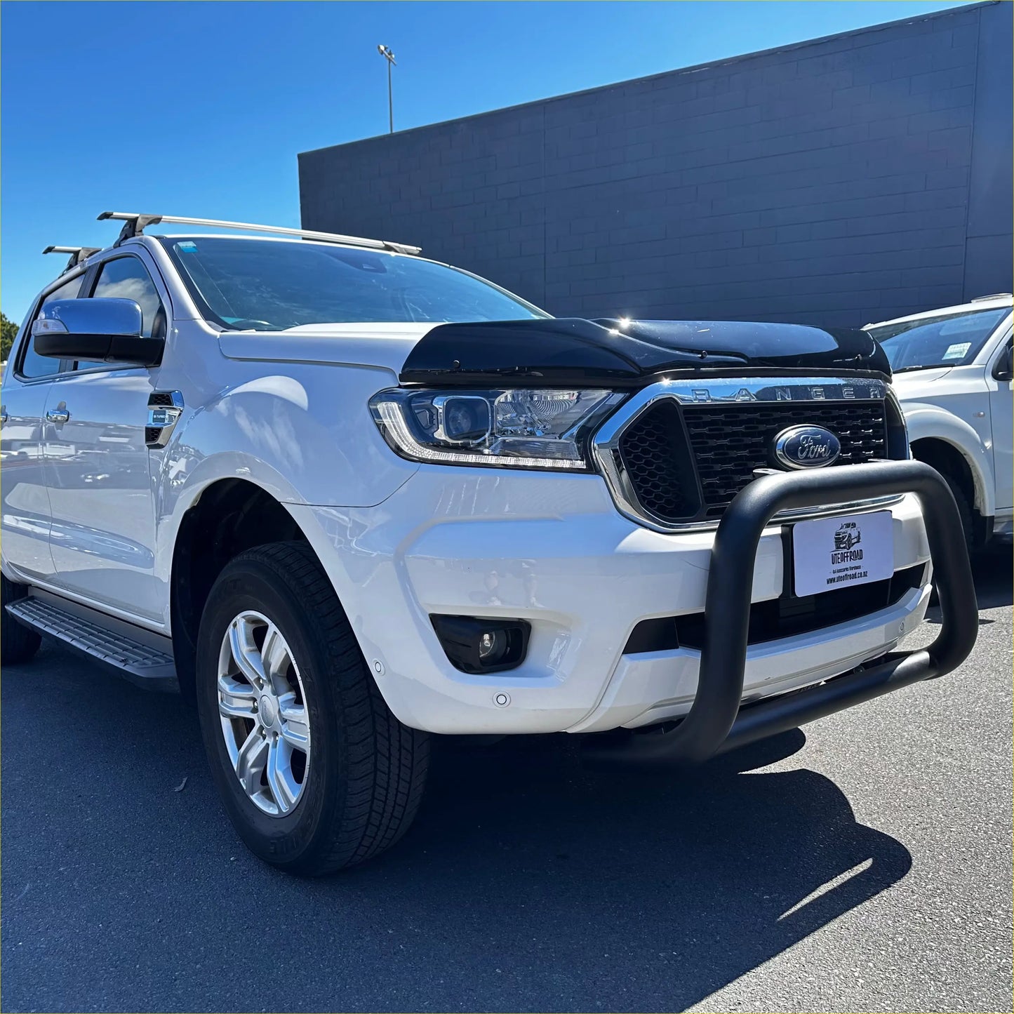 White ford ranger with black front bumper guard and chrome accents featuring bonnet guard protector stone guard for px2 px3 2016-2021