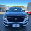 White and black two-tone holden colorado pickup with bold grille and bonnet guard protector stone guard for tough use