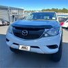 White mazda bt-50 with black grille and chrome accents featuring bonnet guard protector stone guard 2012-2020