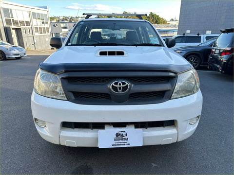 White toyota hilux with a matte black bonnet guard protector stone guard and black front grille and roof rack