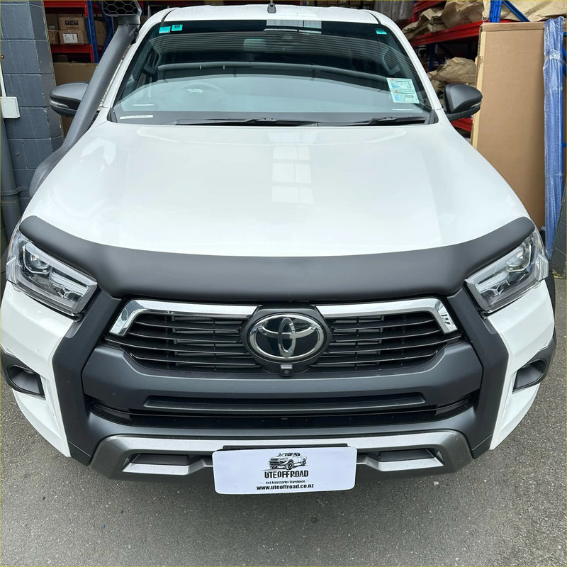 White toyota hilux 2021 plus with matte black bonnet guard protector and black front bumper guard with chrome accents