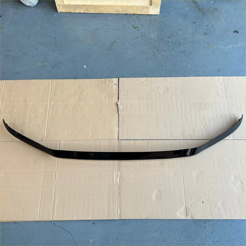 Black glossy rear spoiler with sleek curved design shown on the back side of bonnet guard protector for Toyota Land Cruiser LC300 2022+