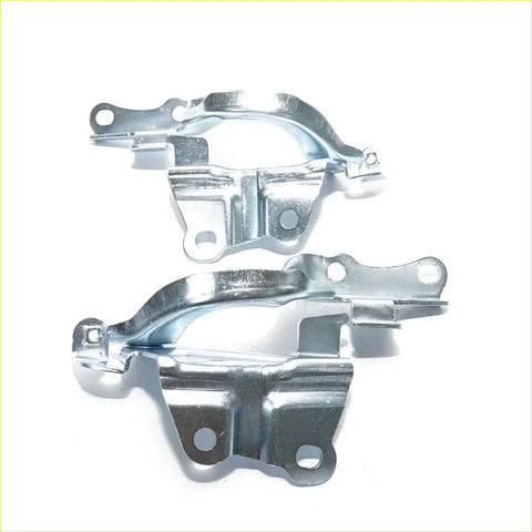 Silver metal bonnet hinge brackets with polished finish and precise cutouts for toyota hilux revo 4wd 2015-2023