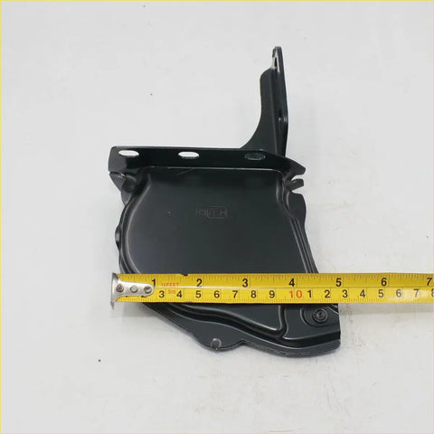 Black metal bonnet hinge with curved angular design and mounting holes for Toyota Hilux RN30 RN31 RN36 RN40 RN41 RN46 1978-1983