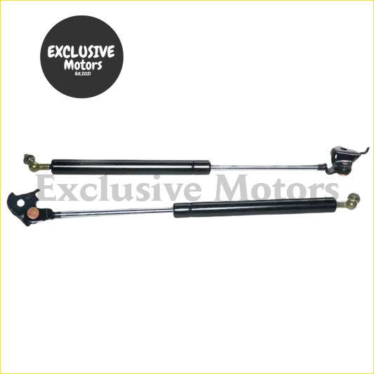 Black gas lift struts with metallic ends and cylindrical body for bonnet hood support on toyota land cruiser lc80
