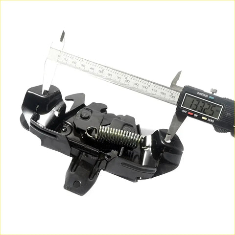 Black plastic and metal bonnet latch striker with spring for mitsubishi pajero montero sport 1996-2008 back side view
