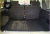 Interior view of nissan patrol y60 boot mat with dark gray rubber geometric pattern and folded rear seats
