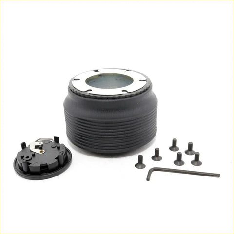 Black ribbed steering wheel hub with silver ring and mounting hardware for boss kit mazda b-series 1961-2012