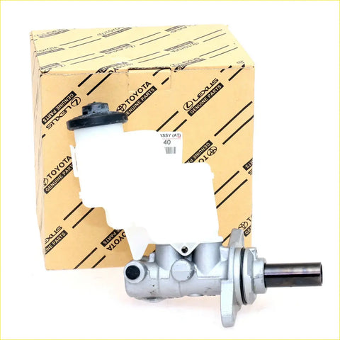 Silver metallic brake master cylinder with white reservoir cap and black seal in toyota lexus genuine parts box for hilux mk7