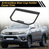 Black carbon fiber textured armrest box rear cup holder cover trim for 2024 toyota tacoma showing back side