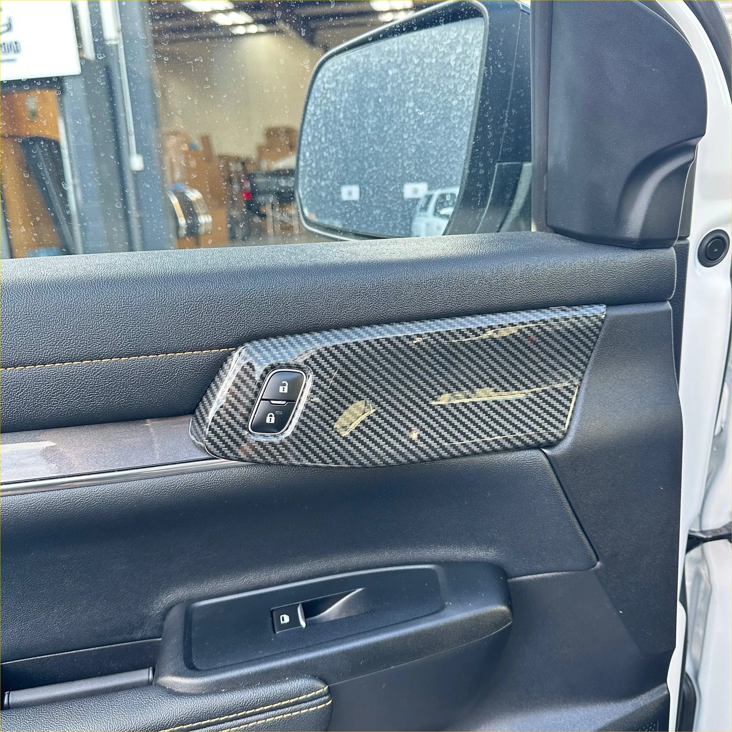 Carbon fiber interior front door panel trim cover for ford ranger with sleek textured weave and subtle gold accent lines