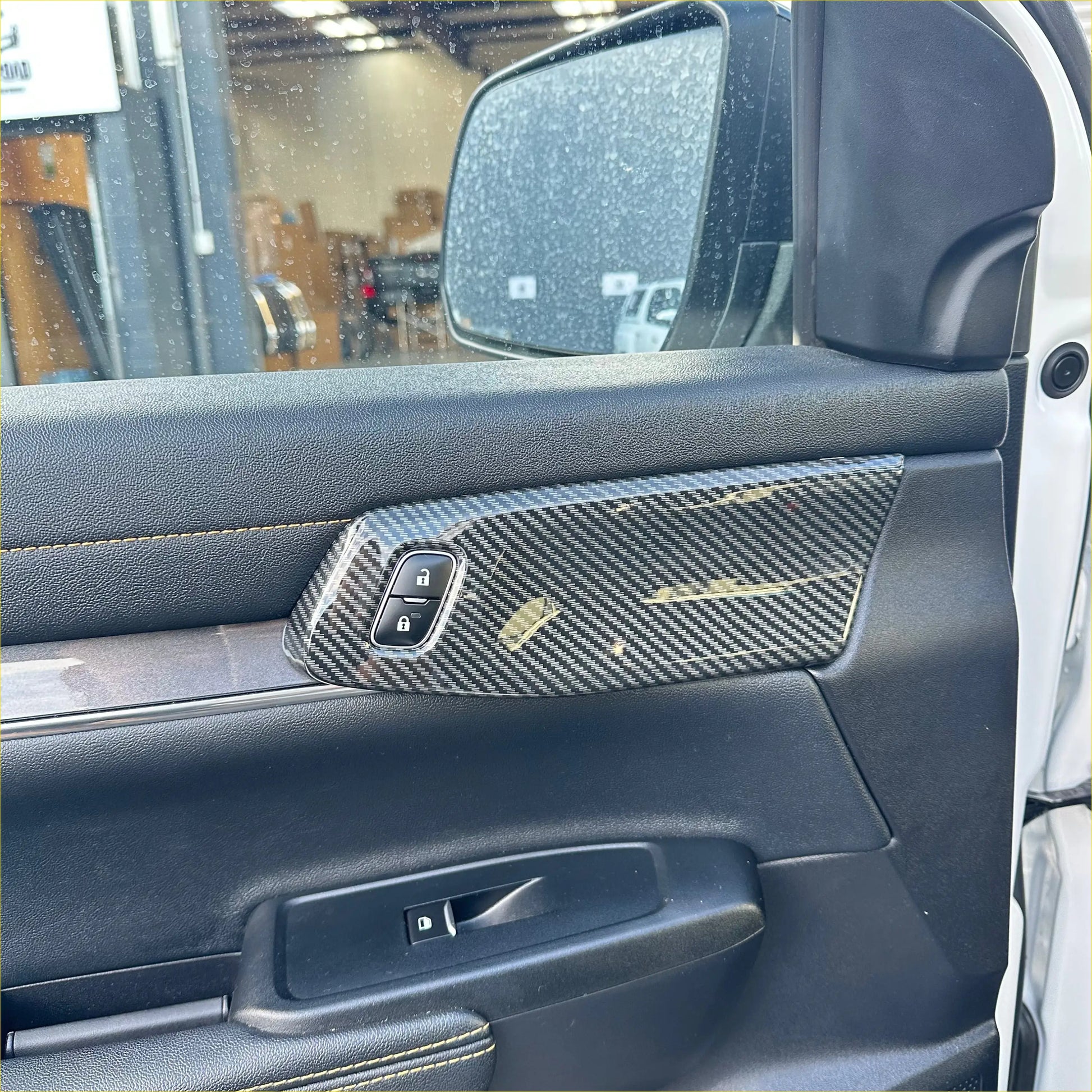 Carbon fiber interior front door panel trim cover for ford ranger with sleek textured weave and subtle gold accent lines
