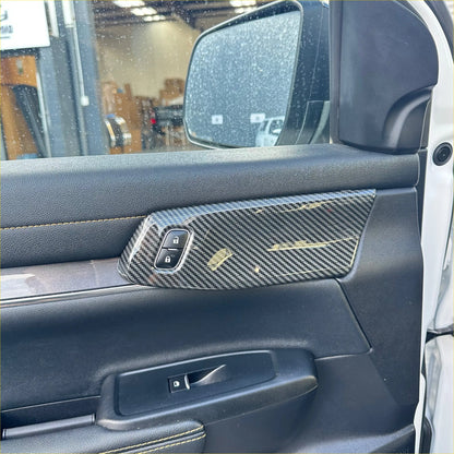 Carbon fiber interior front door panel trim cover for ford ranger with sleek textured weave and subtle gold accent lines