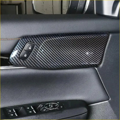 Black carbon fiber textured front door panel trim cover with integrated lock buttons for ford ranger interior