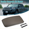 Tan fabric center console lid cover for toyota tacoma 1995-2000 with two black plastic clips shown from back side