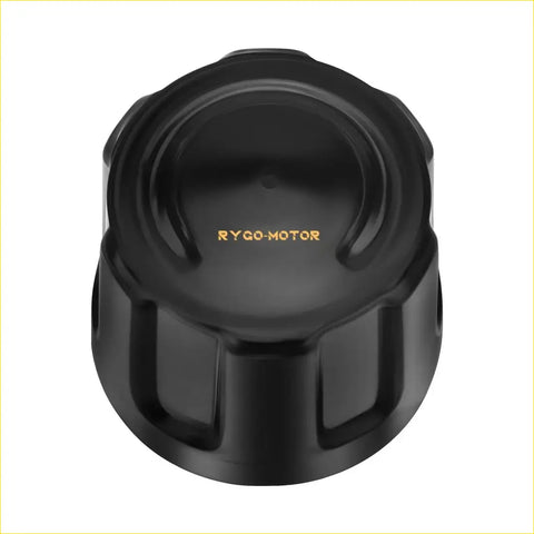 Black textured plastic center hub wheel cap with matte finish and gold rygo motor logo for suzuki quadrunner models