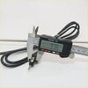 Black digital caliper measuring metal probe with black cable on chrome antenna pillar for Nissan Datsun 720 Dx2WD ute