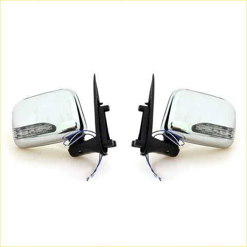 Chrome door wing mirror set with led turn signals and black mounts for toyota hilux mk5 2001-2005 shown from back side