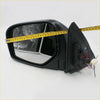 Black plastic electric wing mirror with reflective glass and exposed wiring for mitsubishi l200 triton warrior back view