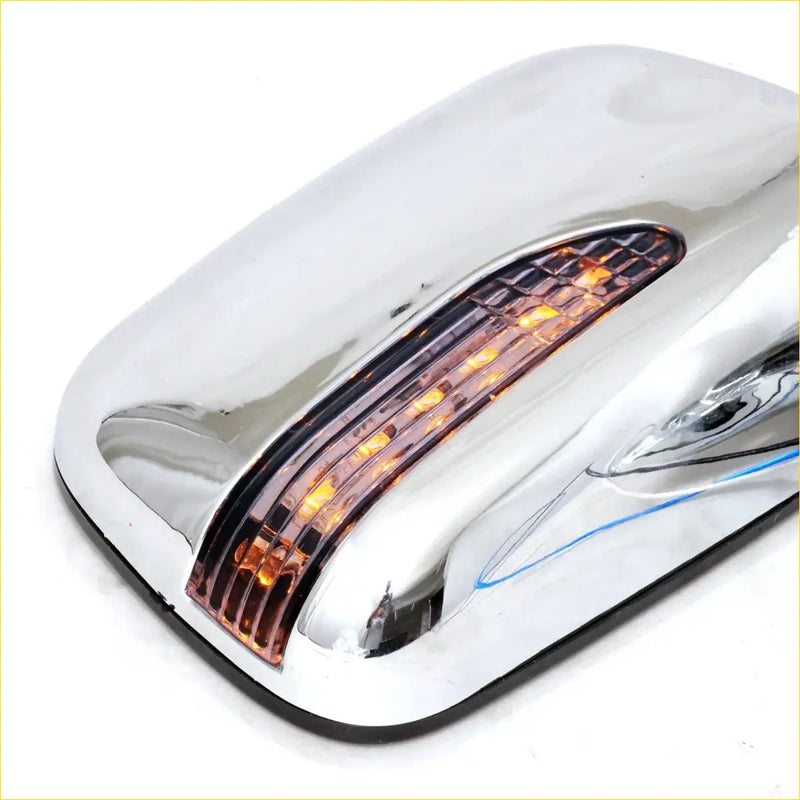 Chrome finished door mirror cover with integrated amber led turn signal for toyota hilux pickup 1985-2001 back side