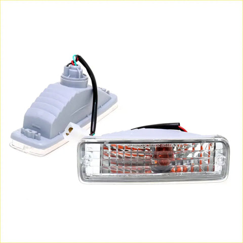 Clear turn signal light for Toyota Hilux LN85 LN100 LN106 with clear rectangular lens and red LED in gray plastic housing