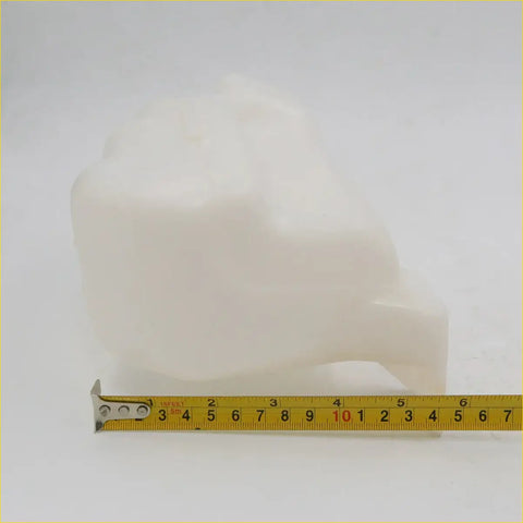 Coolant reservoir for datsun nissan ute 720 1979-1987 made of smooth opaque white plastic with rounded shape