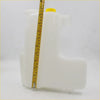 White plastic coolant reservoir tank with yellow cap for nissan terrano navara np300 1997-2004 shown from back side