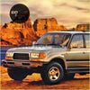 Silver toyota land cruiser 100 suv with chrome accents and black trim showing corner lights for lc80 and fj80 models