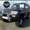 Black toyota land cruiser 70 with chrome grille and roof rack featuring crystal park lights x 2 for prado 90-96
