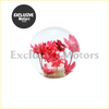 Clear glass crystal flower gear shift knob with vibrant pink and red dried flowers in woven basket base