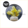 A clear glass dome with preserved yellow flowers in a white ceramic vase for a crystal transparent manual shifter knob