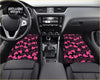 Pink heart-patterned custom love hearts floor mats designed for car interiors with a black background