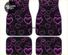 Black car floor mats with vibrant glowing purple and white neon heart outlines called custom neo pink hearts floor mats