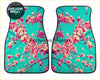 Teal car floor mats with vibrant pink and white blossom floral pattern on dark branches for custom pink blossom mats