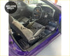 Purple car interior with custom universal bride style black and white floor mats for stylish protection