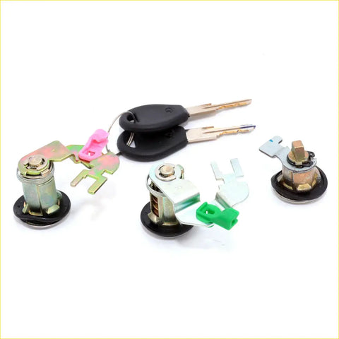 Set of three metallic door and fuel lid lock mechanisms with colored parts and two black key fobs for nissan datsun d21 navara ute 1985-1997