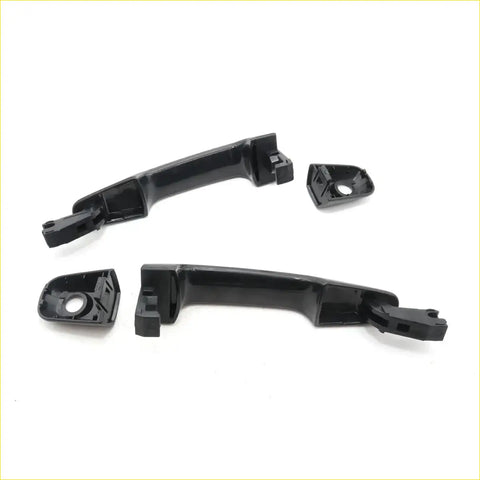 Black plastic door handle components with molded mounting brackets for mitsubishi triton colt l200 1978-1986 backside view