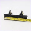 Black plastic car door handle with metal spring and mounting hardware for toyota hilux mark4 1979-1983 backside view