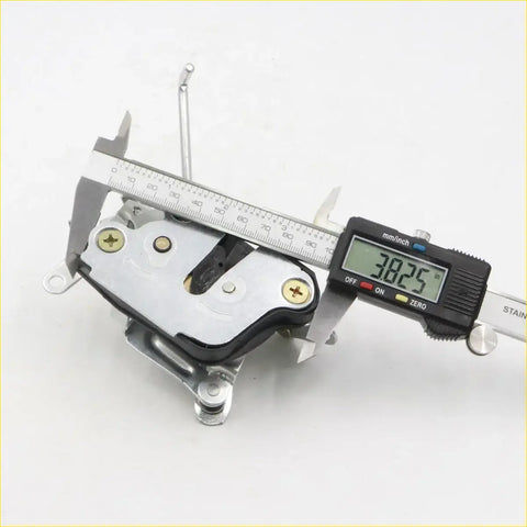Back side of silver metal door lock actuator with black rubber parts and gold screws for toyota hilux 4wd 1988-1997