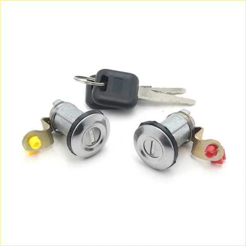 Silver door lock cylinders with black key fobs and yellow red clips for nissan sentra 1995-1999 shown from back side